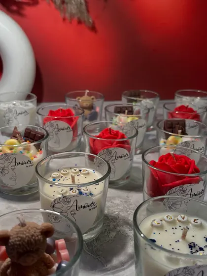 A closer look at the variety in my Valentine's shot glass candle collection. You can find 'LOVE' candles, teddy bear candles, rose candles, and even chocolate-themed ones.