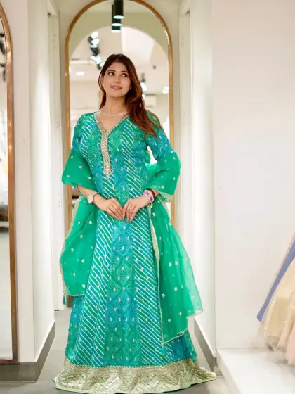Another beautiful shot of the green bandhani Anarkali, showcasing its vibrant color and graceful silhouette.