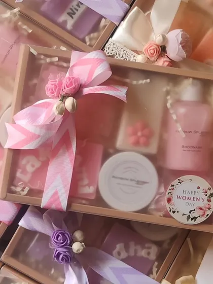 A beautifully wrapped pink-themed gift hamper, perfect for celebrating the women in your life.
