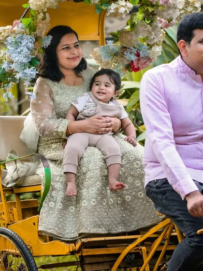 Our vintage yellow rickshaw, set against our outdoor greenery, is a unique and fun prop for family photos. It's large enough to comfortably seat a parent and child.