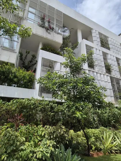 This industrial building is designed with integrated planters and balconies overflowing with greenery. It shows how even functional, large-scale structures can be softened and humanized with landscape architecture.