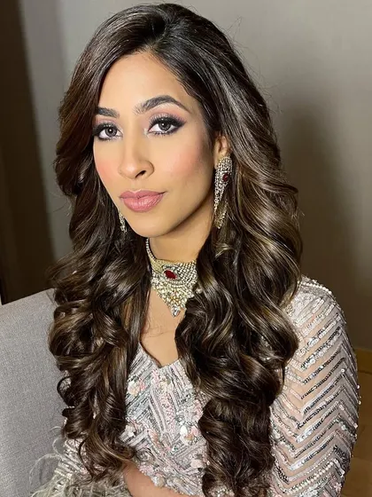 The final look for the bride's sister, a perfect combination of glamorous hair and makeup.