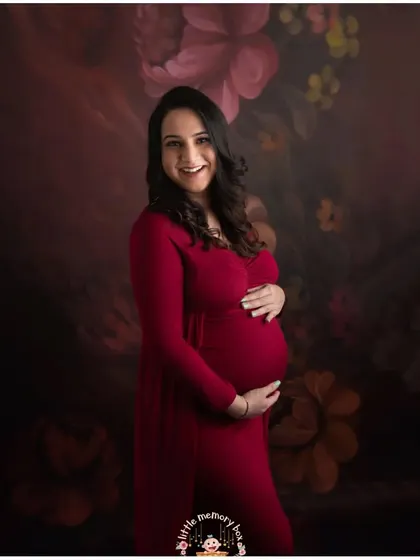 The pregnancy glow is real, and this beautiful mom-to-be is proof. A rich color like this red gown against a soft, floral backdrop creates such a warm and joyful feeling. My goal is to capture your happiness in these simple, beautiful moments.