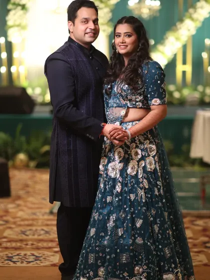 A happy couple posing for a photo at their event. We pride ourselves on creating seamless celebrations where our clients are relaxed and joyful.