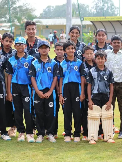 A youth team, including boys and girls, poses for a group photo during the Dasara Cup.