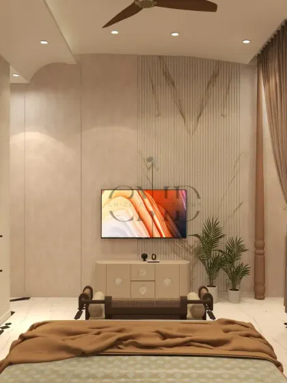 A view from the bed, showing the multi-level curved ceiling and the seamless integration of the TV unit and dressing mirror.