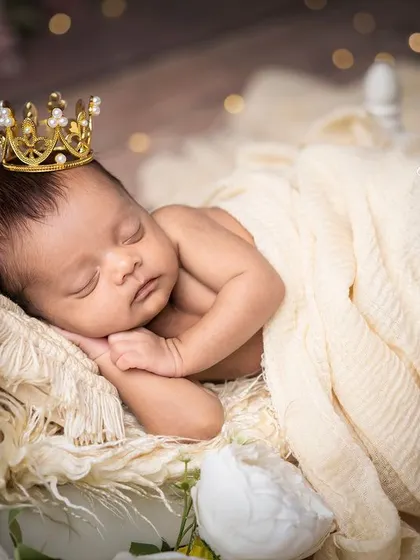 A close-up of the sleeping prince, with soft backlighting creating a gentle, dreamy glow.