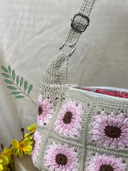 Detail shot of the silver-tone hardware and the neat, sturdy stitching on the adjustable strap.