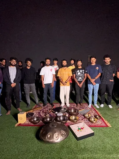 The group from the hackathon wellness session, standing behind the array of sound healing instruments. Even a short break for self-care can dramatically improve creativity and problem-solving.