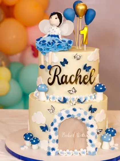 A precious moment from Rachel's first birthday. This 5kg, two-tier eggless chocolate truffle cake was designed to match her beautiful blue dress.