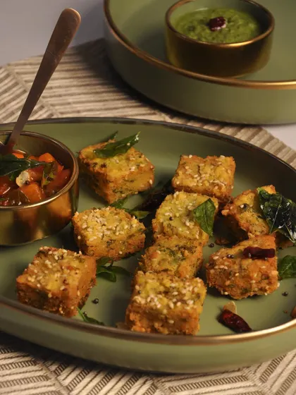 A professionally shot image of my Kothimbir Vadi, a savory cilantro cake. It's a traditional snack from Maharashtra that I love to include in my Indian menus.