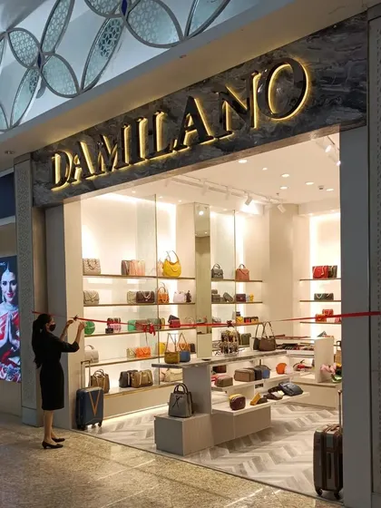The Da Milano store at Mumbai's MIAL Airport, designed for high visibility and quick browsing in a busy travel retail environment.
