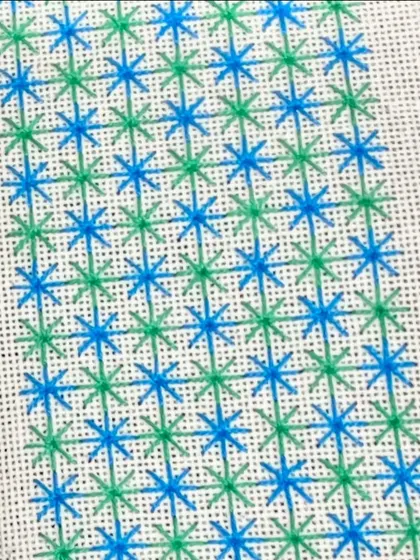 A close-up of a star-like stitch sampler. Learning embroidery is a great way to update your creative skills.