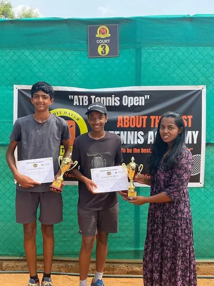 The boys' doubles finalists with their trophies.
