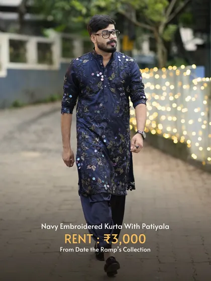 For a more traditional yet stylish look, this navy embroidered kurta with a patiala is a great option for any festive event.