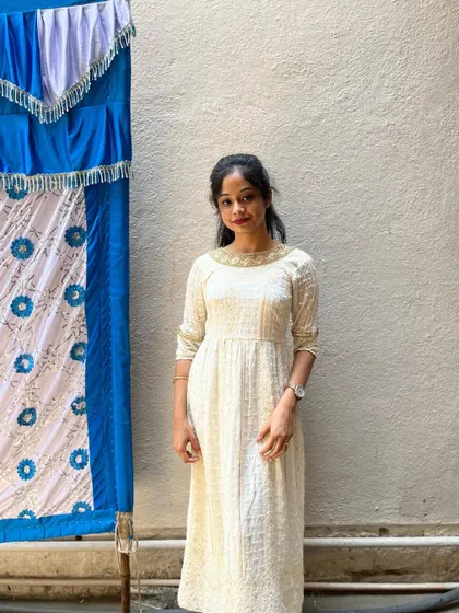 The full view of the simple and graceful cream kurta.