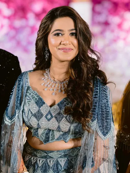 A portrait of the bride, her soft glam makeup and diamond jewelry creating a look of pure elegance.