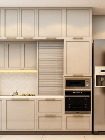 A compact and efficient kitchen layout. The design features seamless off-white cabinetry, an integrated oven and microwave, and a side-by-side refrigerator, making the most of the available space.