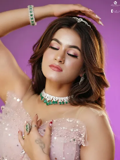 A close-up of the soft pink eyeshadow and glowing skin.