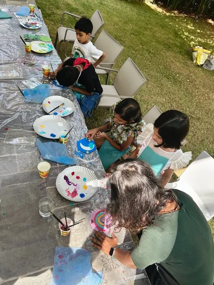 Kids and adults painting together in a lovely outdoor setting. My workshops are designed for all ages to enjoy.