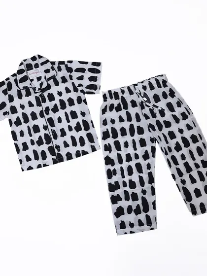 A flat lay of our modern and unisex Rocky print pyjama set. The black and white abstract pattern is a stylish choice for any child.
