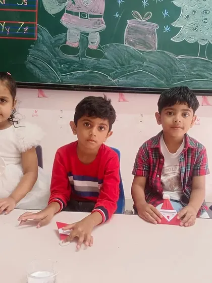 Students work on making their own Santa Claus crafts, a fun and creative activity for the holiday season.