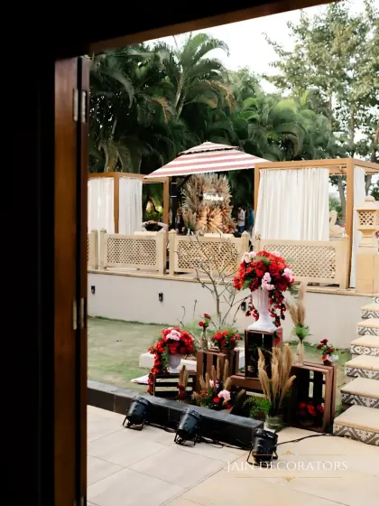 A peek into the event space from a doorway. This view shows how I layer different decor elements, from the floral arrangements in the foreground to the lounge areas in the back.