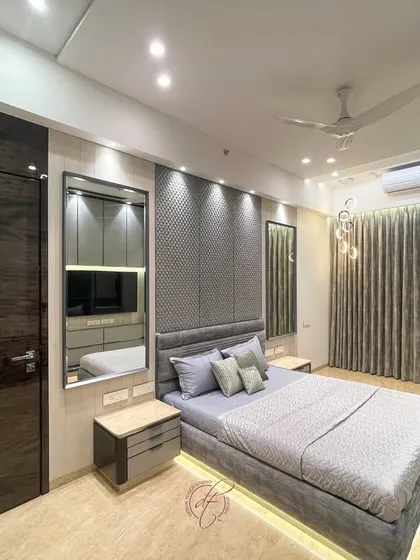 A full view of the grey bedroom, showcasing the interplay of rich textures and a serene color palette. The design creates a sophisticated sanctuary for ultimate comfort.