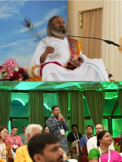A participant asks a question during a wisdom session with me. Our programs are interactive, providing a space for you to clarify doubts and deepen your understanding of life and consciousness.