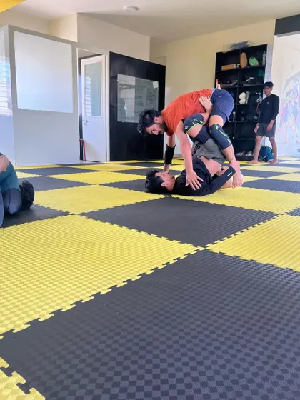 A student practices a guard pass during a BJJ class. Join us to learn the art of jiu-jitsu.