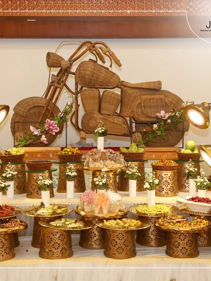 A creative and eye-catching dry fruit and snack counter, featuring a large motorcycle sculpture made from wicker. This is how we add a fun, personalized touch to your celebration.