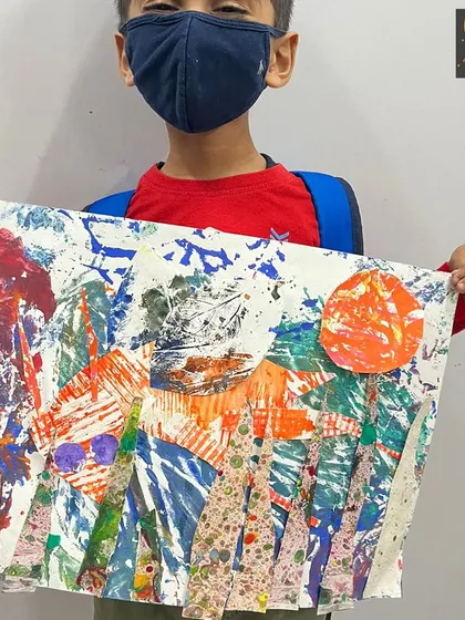 This dynamic, multi-layered artwork was created through a process of printing and collage. It’s a perfect example of how sensory exploration can lead to beautifully complex results.