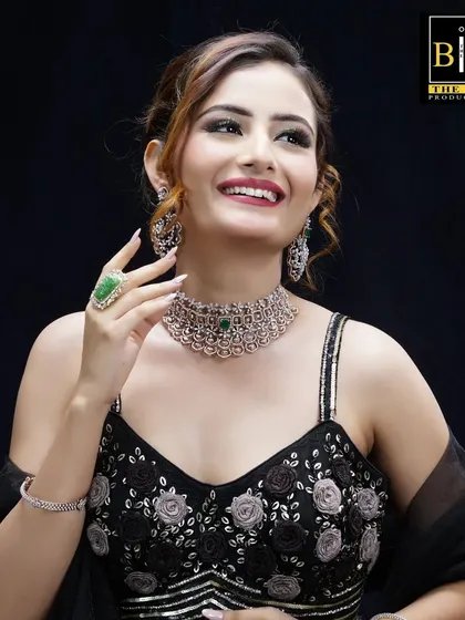 This image showcases a different set of jewelry with the same versatile updo. It demonstrates my ability to create hairstyles that work for various commercial looks.