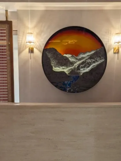 This piece, 'Land of Rising Sun,' was a special commission for Arunachal Bhavan in Delhi. It was a joy to bring the serene beauty of the mountains to life using rich textures and glowing resin, creating a focal point for this beautiful space.