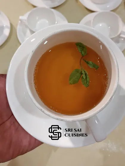 The classic Malabar Sulaimani Tea, a fragrant black tea infused with lemon and mint. It's a perfect, light beverage to serve after a heavy meal.