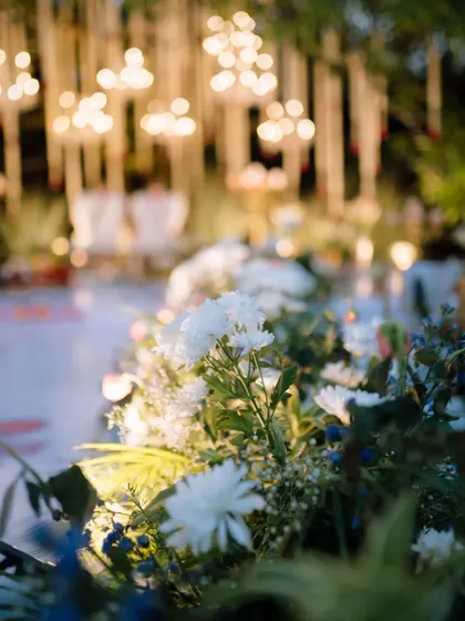 A close-up of the beautiful white floral arrangements that lined the aisle of the wedding ceremony.