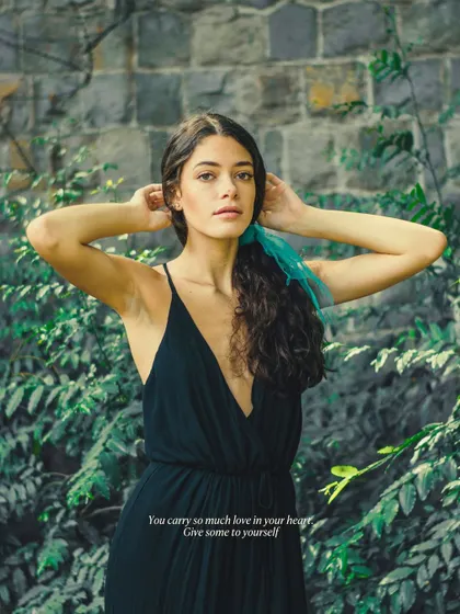 A classic portrait against a lush green backdrop. My goal is to create timeless images that you'll cherish, focusing on simple, elegant poses that highlight your natural beauty.