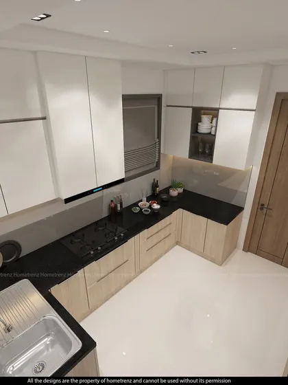 An L-shaped kitchen layout that makes efficient use of a corner space. The handle-less cabinets and integrated appliances maintain a sleek and modern profile.