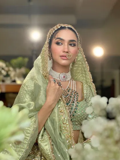 Another angle of the stunning traditional bridal look, showing how it catches the light and creates an aura of grace.
