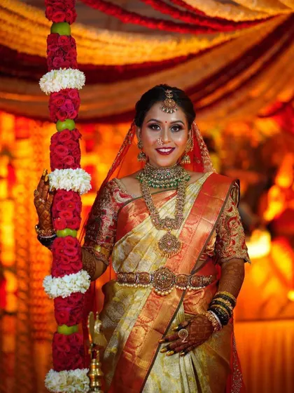 A full view of this happy bride. Her makeup is designed to last through all the ceremonies while keeping her looking fresh and radiant.