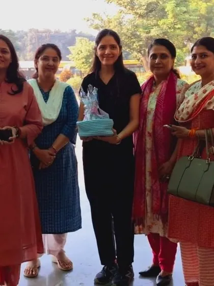 A group photo with teachers from a DPS school after a professional development session. I'm holding a gift, a lovely gesture of appreciation that makes these collaborations so rewarding.