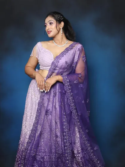 Lilac and purple are the colors of the season. This look features a beautiful purple lehenga with matching lilac eye makeup.