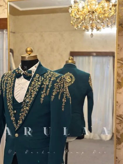 A closer look at the craftsmanship on this teal wedding suit. You can see the reflection of the back embroidery in the mirror, showing how I design the garment to be stunning from every angle.