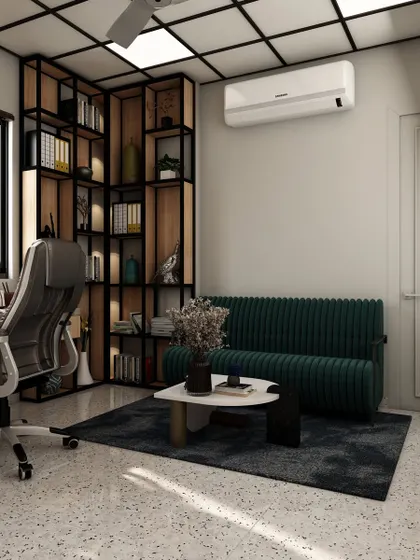 This view highlights the comfortable green sofa and corner bookshelf unit, showing how a private office can be designed to accommodate both focused work and informal meetings or breaks.