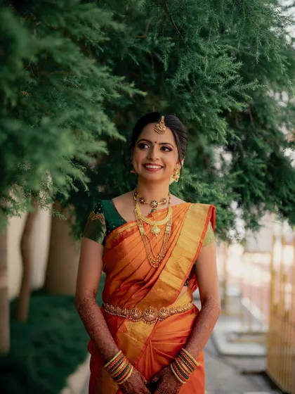 A joyful, candid shot. The natural light highlights the fresh, dewy finish of her makeup, creating a look that is both timeless and effortlessly beautiful.