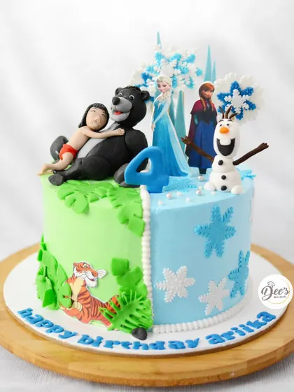 When you can't choose just one favorite, why not have both? This half-and-half cake combines the icy world of Frozen with the lush jungles of The Jungle Book.