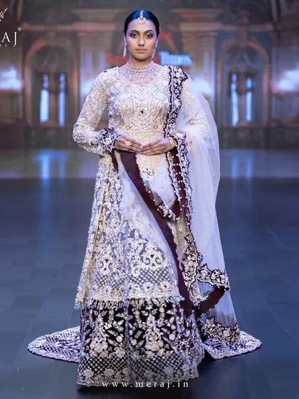 A full view of the light peach and wine Indo-Western bridal lehenga, the epitome of grace and grandeur.