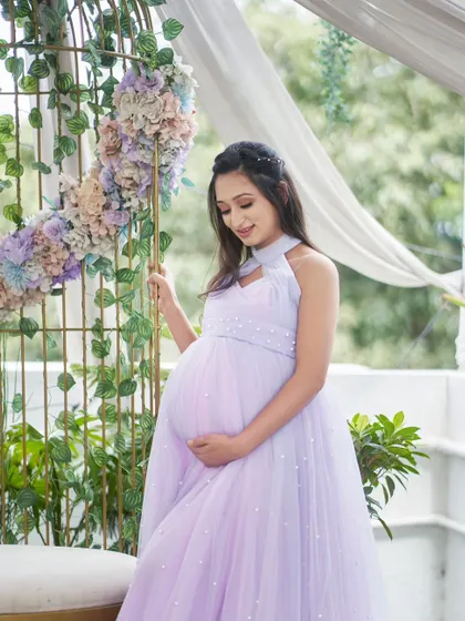Our Breezy gown in a beautiful two-tone lavender and pink. The halter-neck design and pearl details make this a unique and eye-catching dress.