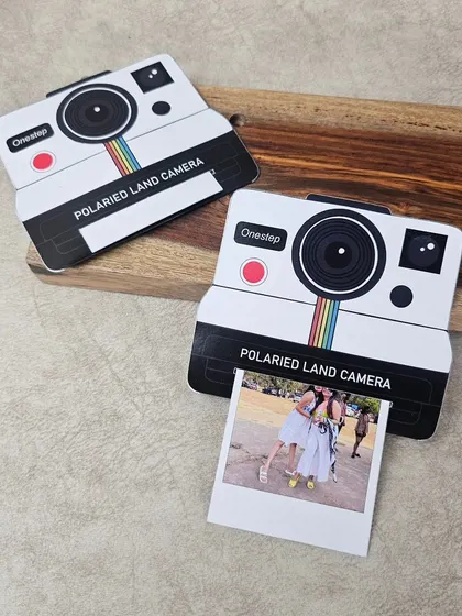 Duplicate of 65. Another shot of the polaroid-style pull-up card, showing its unique design and nostalgic appeal.