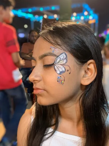 Another angle of the white and silver butterfly, showing the fine details and glitter.